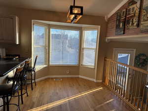 Dining area with hardwood flooring