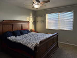 Bedroom with carpet floors and ceiling fan