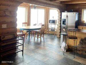 Dining space featuring beamed ceiling