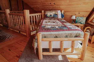 Bedroom featuring wood-type flooring