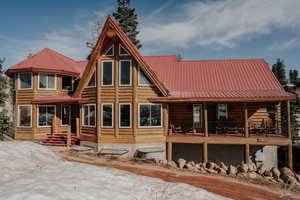 Rear view of house with metal roof