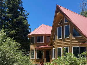 View of front of home with a metal roof