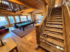 Rec room featuring beamed ceiling, wood ceiling, wood-type flooring, and billiards