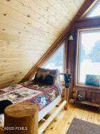 Bedroom featuring wood ceiling, lofted ceiling, and wood-type flooring