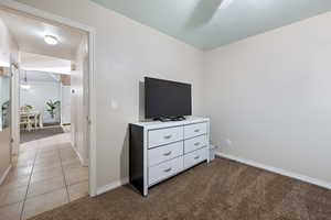 Bedroom featuring carpet floors and a textured ceiling