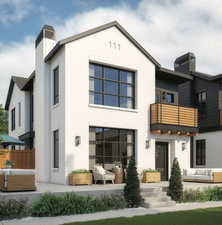 Rear view of house with a balcony, outdoor lounge area, and a patio area