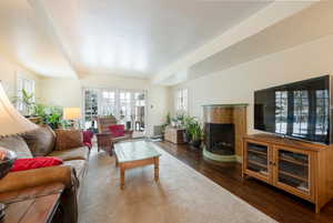 Living room with dark hardwood / wood-style flooring