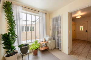 Interior space featuring light tile patterned flooring