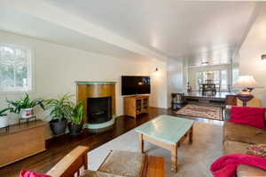 Living room featuring dark hardwood / wood-style flooring and a chandelier