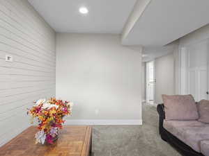 Interior space featuring carpet floors and wood walls