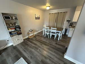 Dining space featuring dark hardwood / wood-style flooring