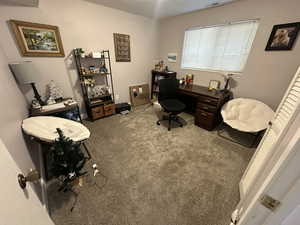 Home office featuring carpet flooring