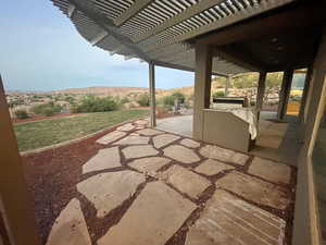 View of patio / terrace featuring a mountain view and a pergola