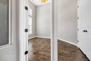 Unfurnished room with dark hardwood / wood-style flooring