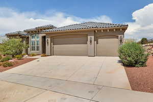 Mediterranean / spanish-style home featuring a garage