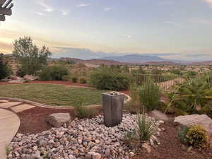 Yard at dusk with a mountain view