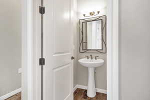 Bathroom with hardwood / wood-style floors