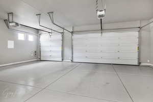 Garage featuring a garage door opener