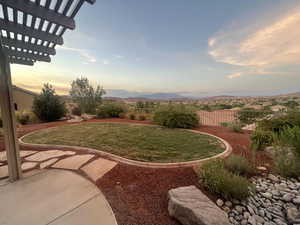 Yard at dusk with a mountain view