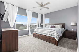 Bedroom featuring carpet floors and ceiling fan