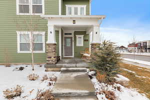 View of snow covered property entrance