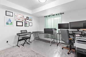 Office area featuring a textured ceiling