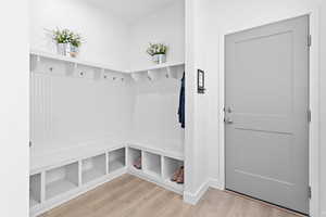 Mudroom featuring wood-type flooring