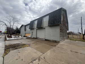 View of side of property featuring a garage