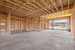 Miscellaneous room with concrete flooring and a mountain view