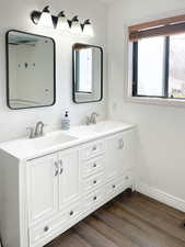 Bathroom with vanity and hardwood / wood-style floors