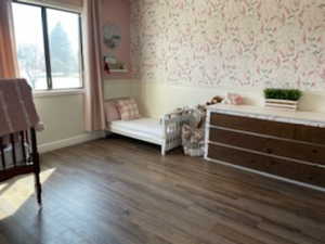 Bedroom featuring dark wood-type flooring