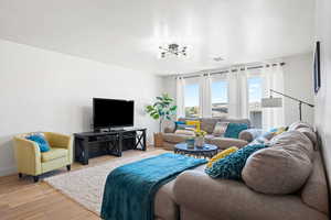 Living room featuring a textured ceiling and light wood-type flooring