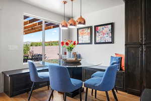 Dining area with light hardwood / wood-style floors