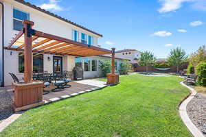 View of yard featuring a patio and a pergola