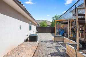 View of yard featuring cooling unit and a mountain view