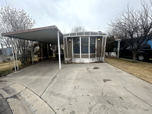 Exterior space featuring a carport