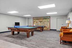 Playroom with pool table and carpet