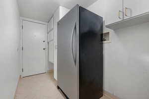 Utility room where washer and dryer can be installed. The Freezer is included, but would need to be removed to add a dryer.