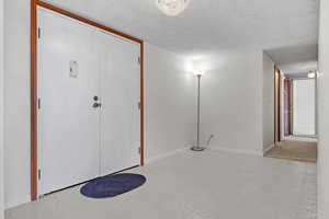 Entrance foyer featuring a textured ceiling