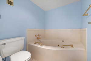 Bathroom featuring toilet and a bathing tub