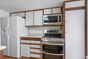 Kitchen with stainless steel appliances and white cabinets