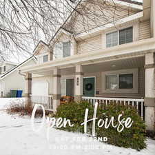 View of front of house featuring an attached garage and a porch