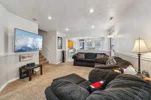 Living room featuring light colored carpet