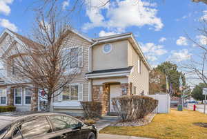 View of front of property with a front lawn