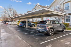 View of vehicle parking featuring a carport