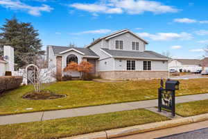 View of front of house featuring a front lawn