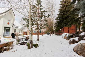 View of yard covered in snow