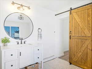 Bathroom featuring vanity and a baseboard heating unit