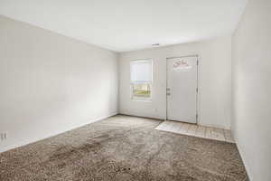 View of carpeted entrance foyer