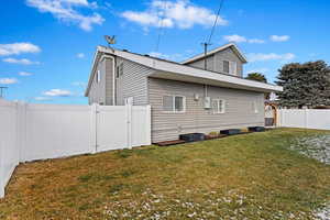 View of home's exterior featuring a lawn